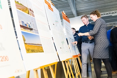 people around a chart during an info session