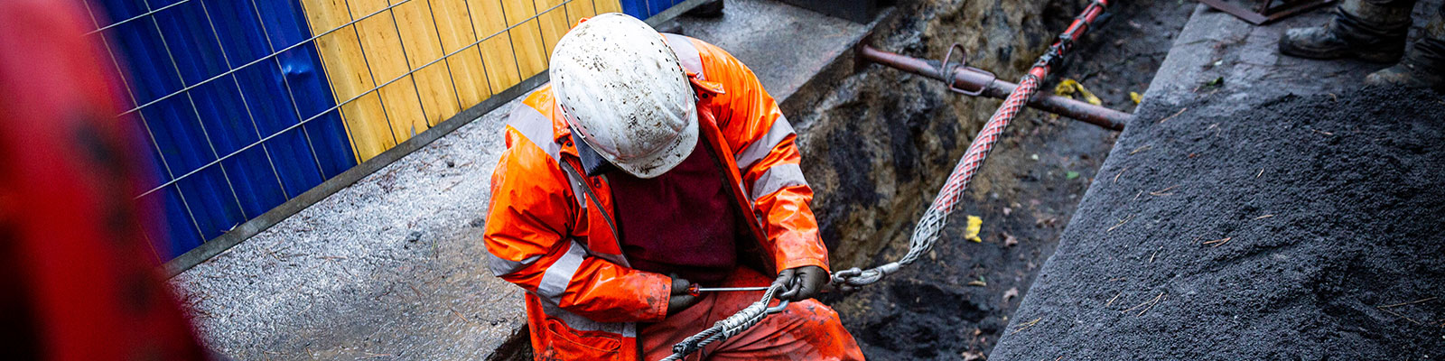 field worker connecting an underground cable