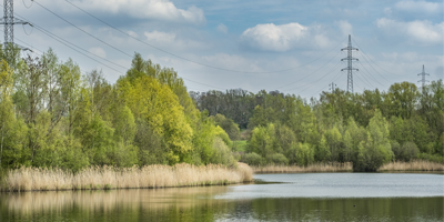 high-voltage line next to a river